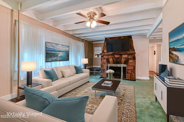 1416 Garven Ave, Ocean Twp, NJ 07712 - living room featuring a ceiling fan, beam ceiling, a fireplace, and carpet floors
