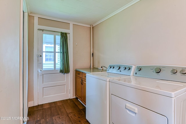 1416 Garven Ave, Ocean Twp, NJ 07712 - laundry room featuring cabinet space, ornamental molding, dark wood-style flooring, and washing machine and clothes dryer