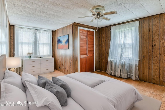 1416 Garven Ave, Ocean Twp, NJ 07712 - bedroom featuring wood walls, a closet, and ceiling fan