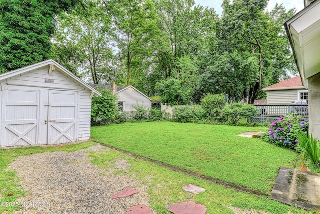 1416 Garven Ave, Ocean Twp, NJ 07712 - view of grassy yard featuring a storage unit