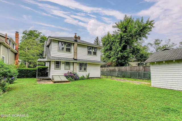 1416 Garven Ave, Ocean Twp, NJ 07712 - rear view of property featuring roof with shingles and a chimney