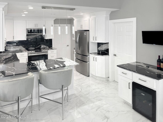 177 N Ensign Dr, Little Egg Harbor, NJ 08087 - kitchen with stainless steel appliances, tasteful backsplash, dark stone counters, and recessed lighting