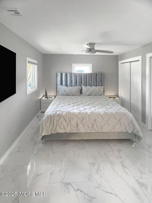 177 N Ensign Dr, Little Egg Harbor, NJ 08087 - bedroom featuring multiple windows, marble finish flooring, and a ceiling fan