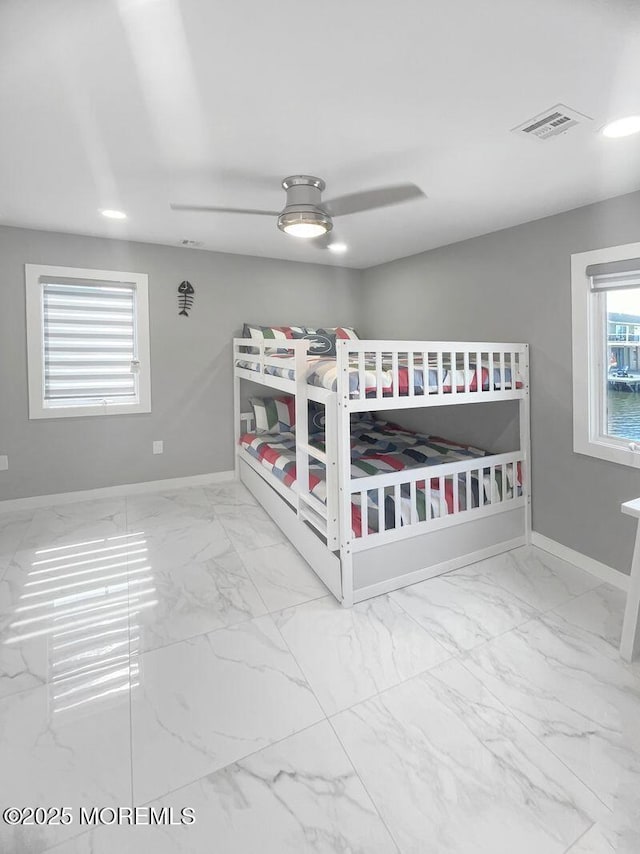 177 N Ensign Dr, Little Egg Harbor, NJ 08087 - unfurnished bedroom with marble finish flooring and a ceiling fan