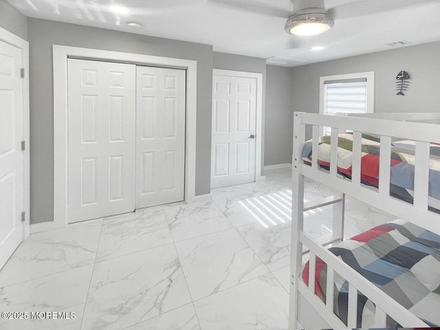 177 N Ensign Dr, Little Egg Harbor, NJ 08087 - bedroom featuring light marble finish floors, a closet, and a ceiling fan