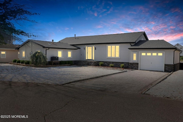 177 N Ensign Dr, Little Egg Harbor, NJ 08087 - ranch-style house featuring a garage, stucco siding, driveway, and stone siding