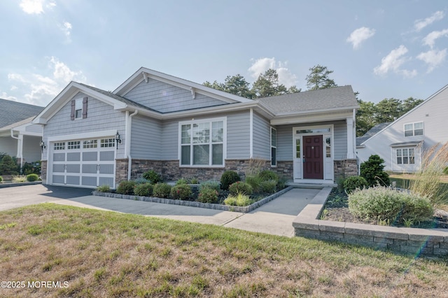 51 Galley Way, Little Egg Harbor, NJ 08087 - craftsman house with stone siding, an attached garage, concrete driveway, and a front yard