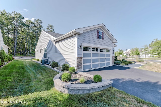 51 Galley Way, Little Egg Harbor, NJ 08087 - view of home's exterior with asphalt driveway, stone siding, a garage, and a lawn