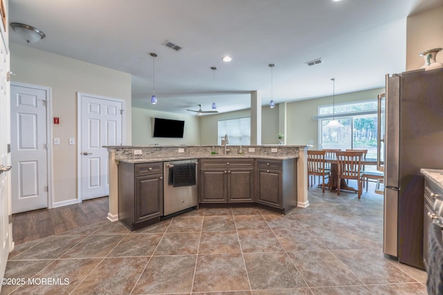 51 Galley Way, Little Egg Harbor, NJ 08087 - kitchen featuring appliances with stainless steel finishes, dark brown cabinets, light stone countertops, hanging light fixtures, and recessed lighting