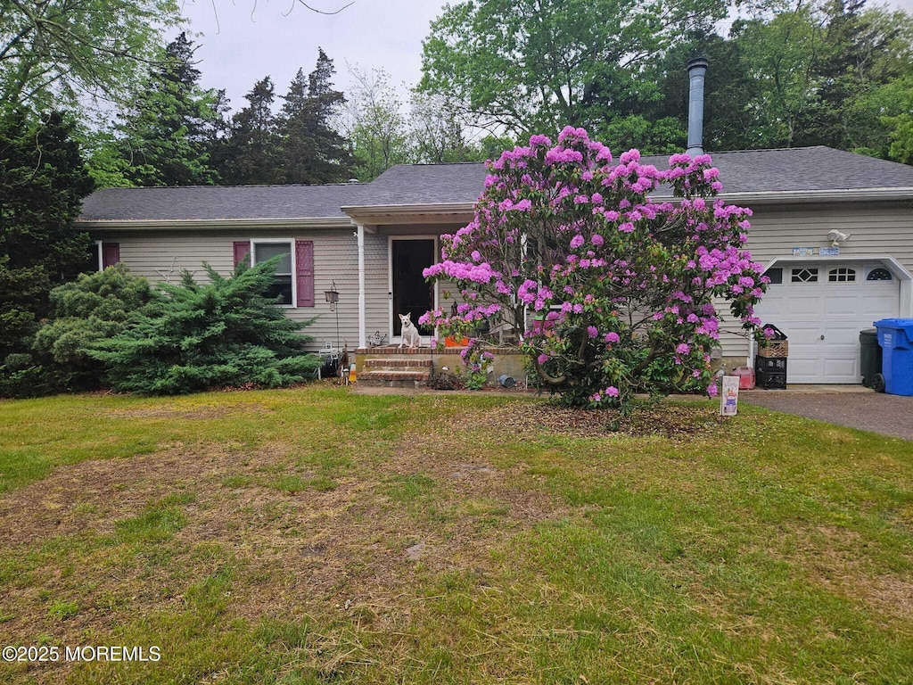 124 Cedar Swamp Rd, Jackson, NJ 08527 - view of front of house with a front yard, an attached garage, and driveway