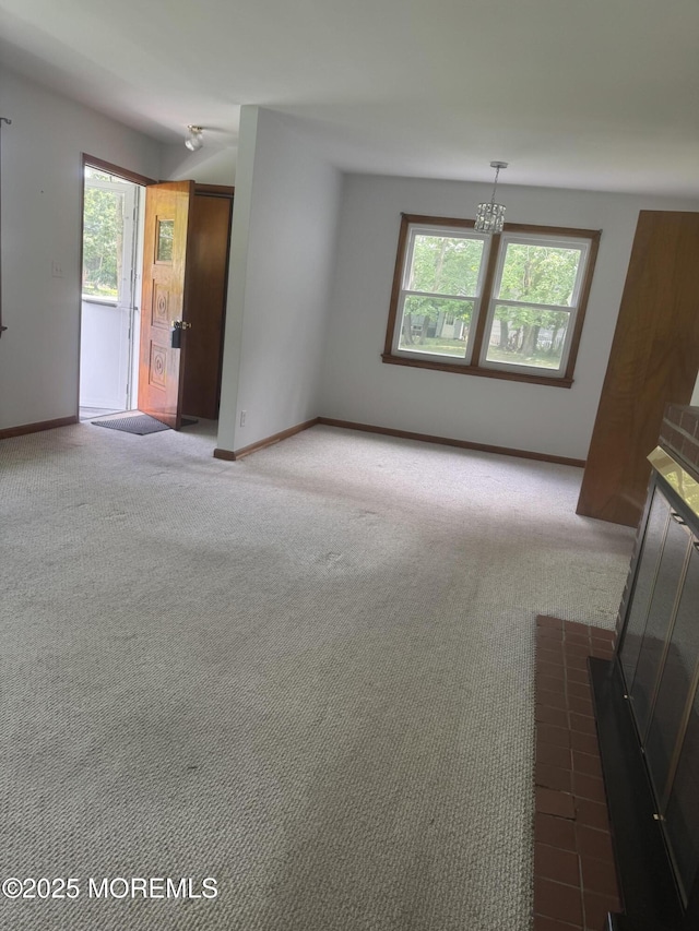 132 Harrison Ave, Fair Haven, NJ 07704 - unfurnished living room with carpet floors and a chandelier