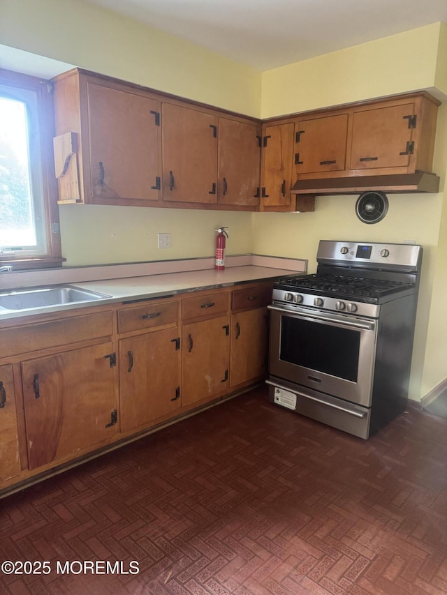 132 Harrison Ave, Fair Haven, NJ 07704 - kitchen featuring gas stove, brown cabinetry, and light countertops