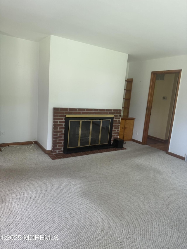 132 Harrison Ave, Fair Haven, NJ 07704 - unfurnished living room with a fireplace and carpet floors