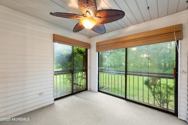 229 Medford Ct Unit B, Manalapan, NJ 07726 - unfurnished sunroom featuring carpet flooring, wooden walls, and ceiling fan