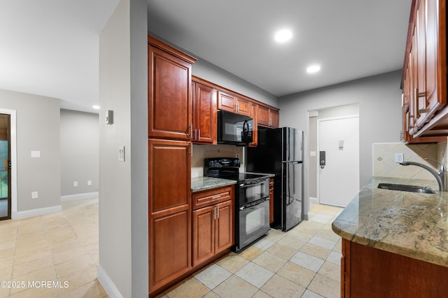229 Medford Ct Unit B, Manalapan, NJ 07726 - kitchen featuring black appliances, decorative backsplash, recessed lighting, light stone counters, and reddish brown cabinets