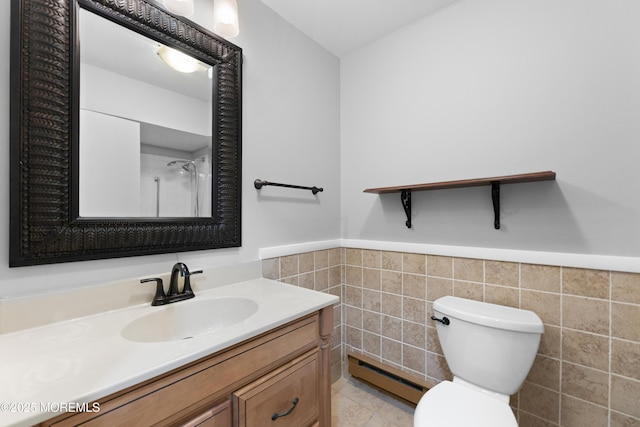 229 Medford Ct Unit B, Manalapan, NJ 07726 - bathroom with baseboard heating, tile walls, a wainscoted wall, vanity, and a shower