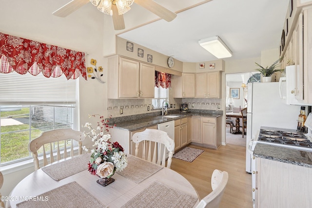 9 Penny Ln, Jackson, NJ 08527 - kitchen with white dishwasher, light wood-style floors, a ceiling fan, decorative backsplash, and dark countertops