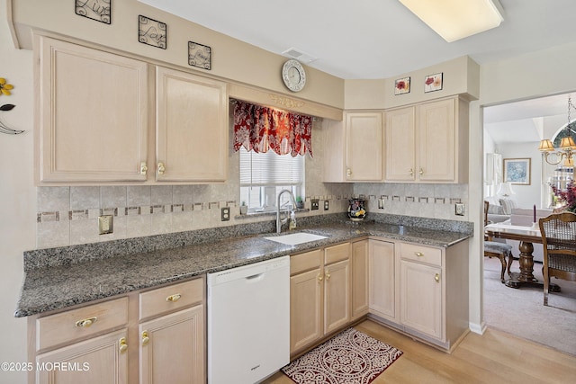 9 Penny Ln, Jackson, NJ 08527 - kitchen with white dishwasher, light wood-style floors, tasteful backsplash, dark stone countertops, and a chandelier