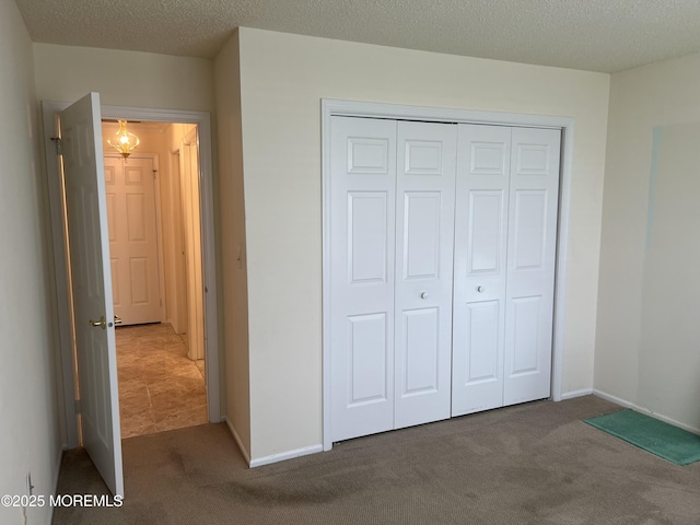 2 Mayapple Dr, Brick, NJ 08724 - unfurnished bedroom featuring carpet floors, a closet, and a textured ceiling