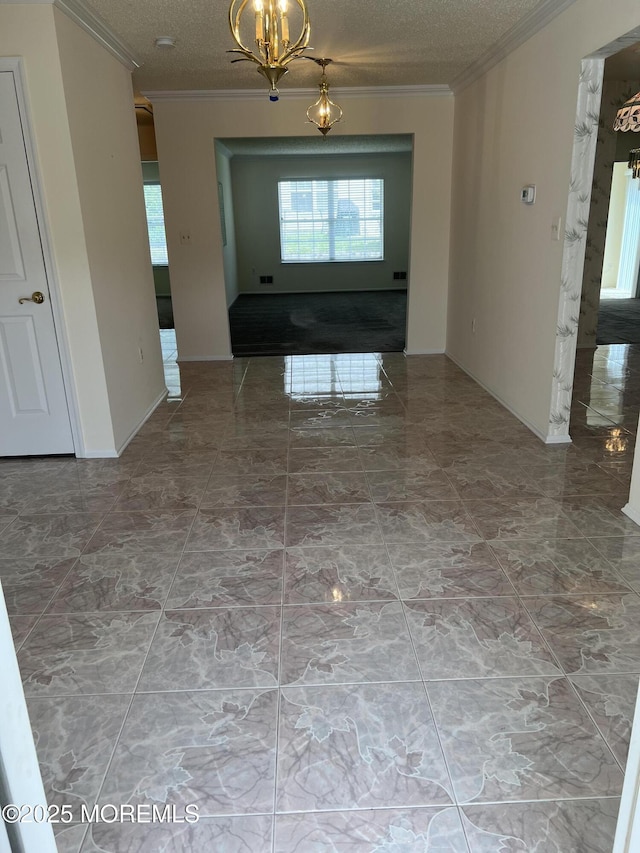 2 Mayapple Dr, Brick, NJ 08724 - corridor featuring ornamental molding, marble look tiles, a chandelier, and a textured ceiling