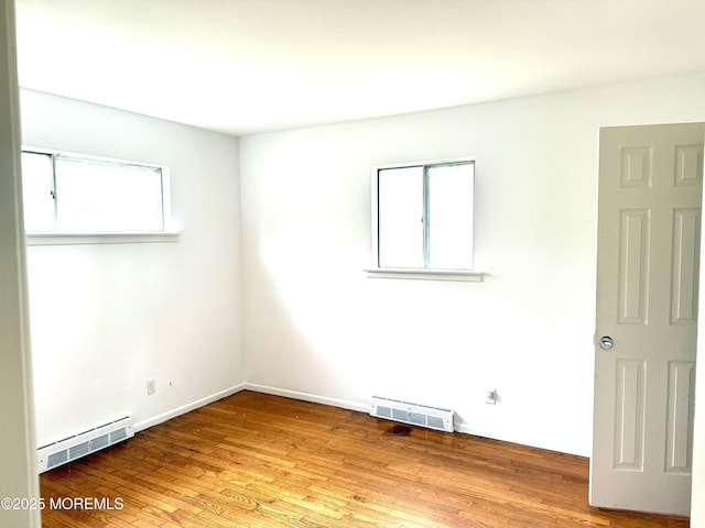 143 Fisher Ave, Brick, NJ 08723 - spare room with baseboard heating and wood finished floors