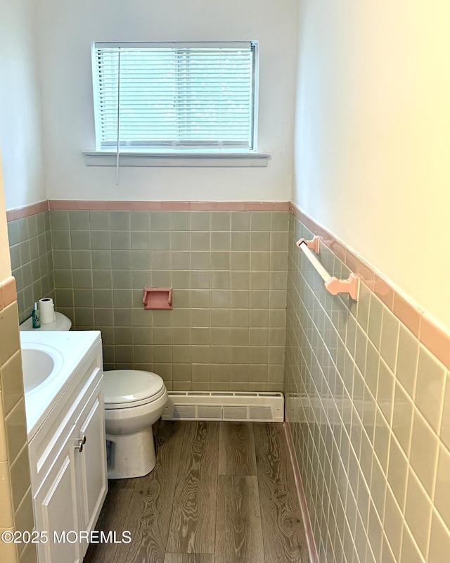 143 Fisher Ave, Brick, NJ 08723 - bathroom featuring tile walls, plenty of natural light, vanity, wainscoting, and wood finished floors