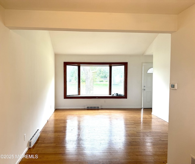 143 Fisher Ave, Brick, NJ 08723 - unfurnished room with wood finished floors and a baseboard radiator