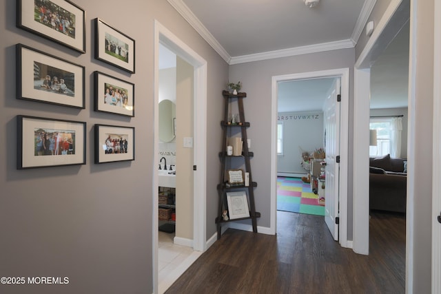1113 Pemberton St, Toms River, NJ 08757 - hallway featuring wood finished floors, ornamental molding, and a baseboard heating unit