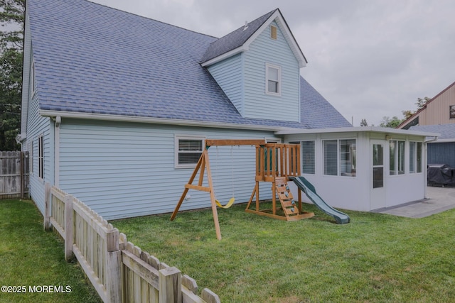 1113 Pemberton St, Toms River, NJ 08757 - back of property featuring roof with shingles and a playground