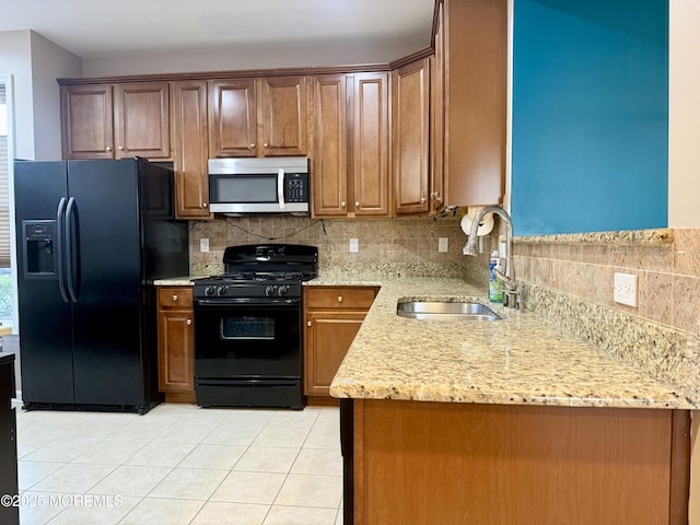 2116 Edward Stec Blvd Unit 2116, Edison, NJ 08837 - kitchen with black appliances, tasteful backsplash, light tile patterned floors, and light stone counters