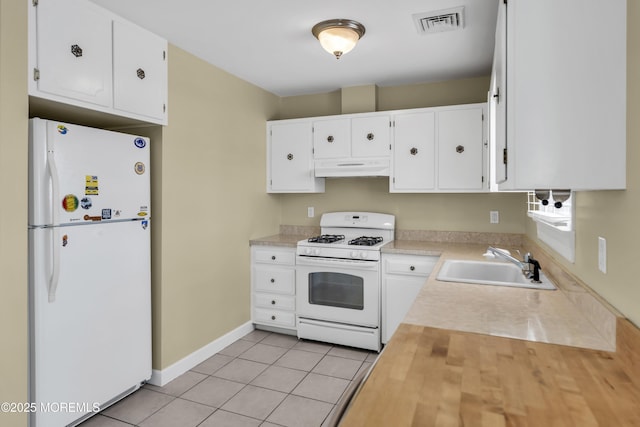 803 Wave Dr, Forked River, NJ 08731 - kitchen featuring white appliances, white cabinets, light tile patterned flooring, and under cabinet range hood