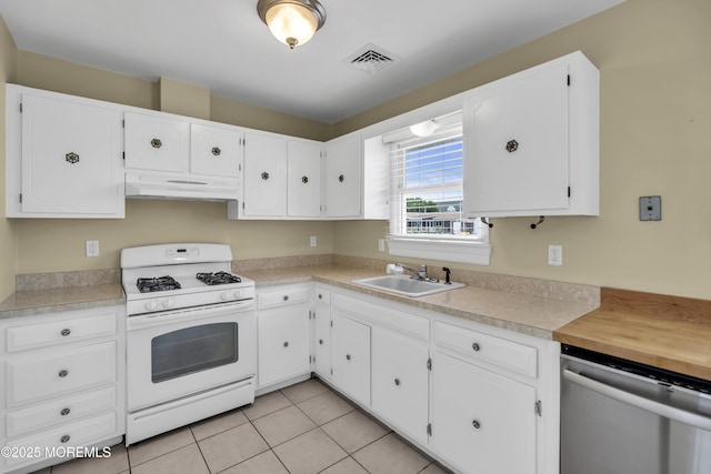 803 Wave Dr, Forked River, NJ 08731 - kitchen with white gas range oven, dishwasher, under cabinet range hood, and white cabinets