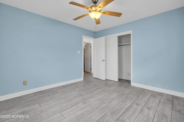 803 Wave Dr, Forked River, NJ 08731 - unfurnished bedroom with wood finished floors, a closet, and ceiling fan