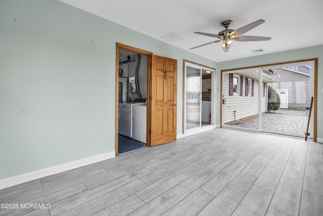 803 Wave Dr, Forked River, NJ 08731 - spare room with ceiling fan, light wood-type flooring, and separate washer and dryer