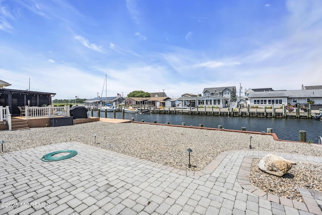 803 Wave Dr, Forked River, NJ 08731 - view of patio with a sunroom, a residential view, a dock, and a water view