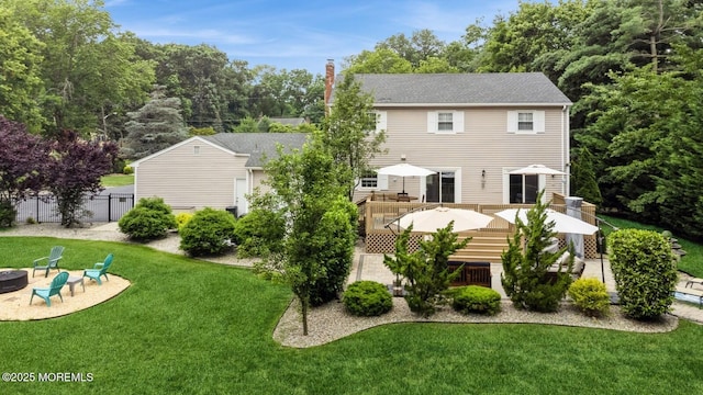 12 Fairway Ave, Eatontown, NJ 07724 - back of property featuring an outdoor fire pit, a wooden deck, and a patio area