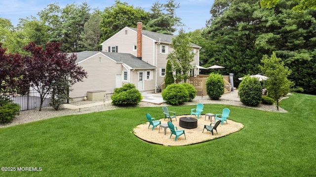 12 Fairway Ave, Eatontown, NJ 07724 - back of property with an outdoor fire pit and a wooden deck