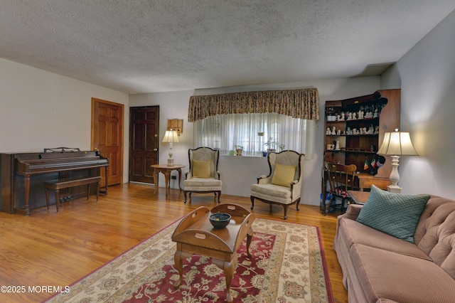 26 Old Manor Rd, Holmdel, NJ 07733 - living area featuring a textured ceiling and wood finished floors