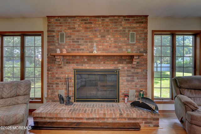 26 Old Manor Rd, Holmdel, NJ 07733 - living area featuring a fireplace, wood finished floors, and plenty of natural light
