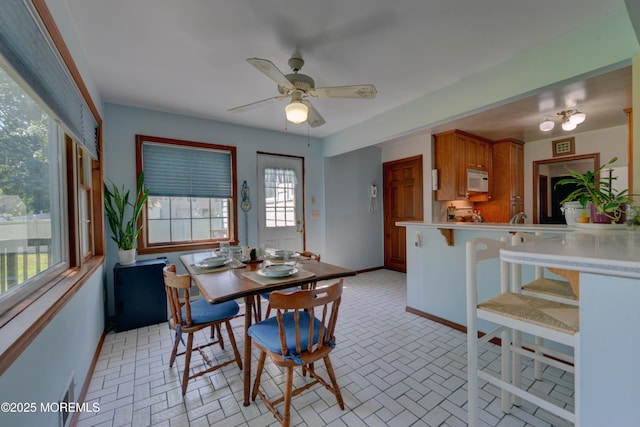 26 Old Manor Rd, Holmdel, NJ 07733 - dining area with brick patterned floors and ceiling fan
