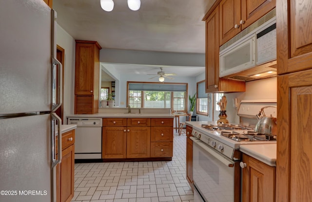 26 Old Manor Rd, Holmdel, NJ 07733 - kitchen featuring white appliances, brown cabinets, and light countertops