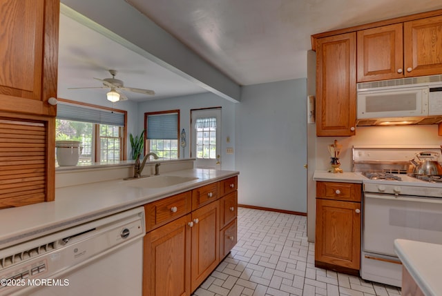 26 Old Manor Rd, Holmdel, NJ 07733 - kitchen with white appliances, light countertops, brown cabinetry, and brick patterned flooring
