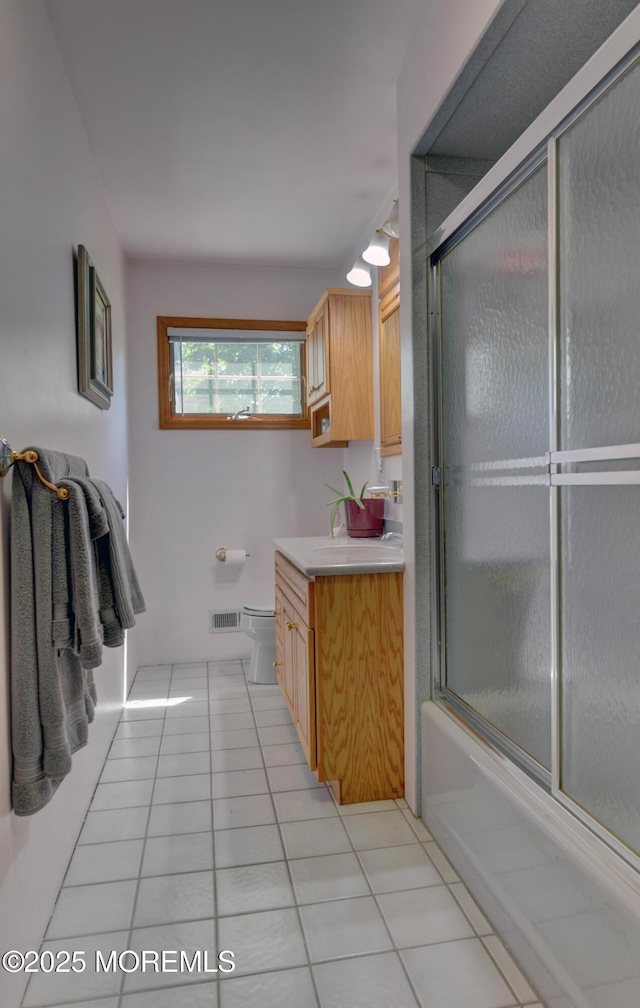 26 Old Manor Rd, Holmdel, NJ 07733 - bathroom featuring tile patterned floors, vanity, and enclosed tub / shower combo