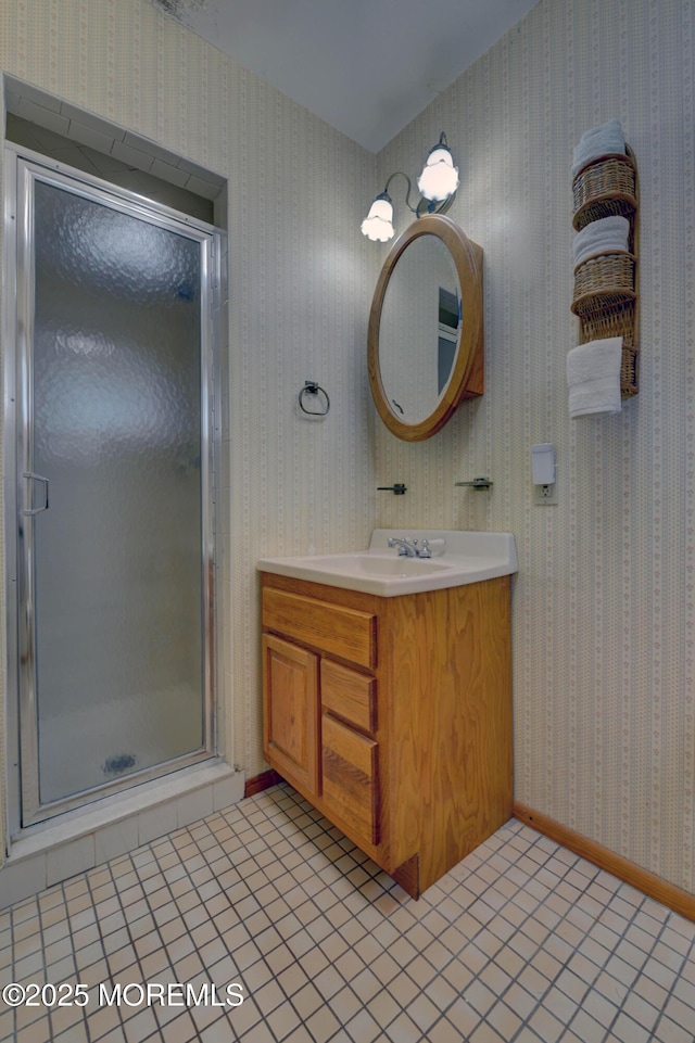 26 Old Manor Rd, Holmdel, NJ 07733 - bathroom with vanity, wallpapered walls, a stall shower, and tile patterned floors