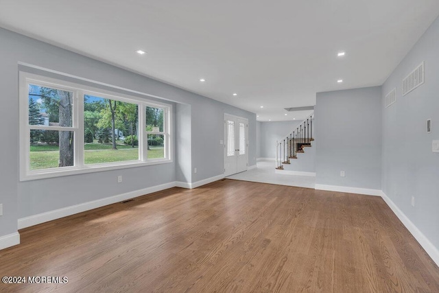 166 Montrose Rd, Colts Neck, NJ 07722 - unfurnished living room featuring stairs, wood finished floors, french doors, and recessed lighting