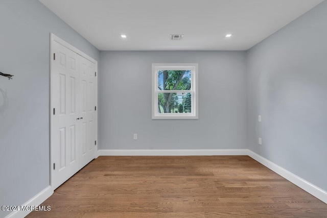 166 Montrose Rd, Colts Neck, NJ 07722 - unfurnished bedroom featuring wood finished floors, a closet, and recessed lighting