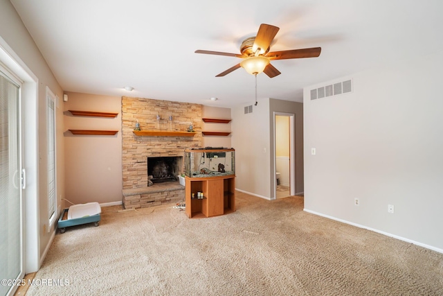 424 Continental St, Forked River, NJ 08731 - unfurnished living room featuring ceiling fan, a stone fireplace, and light carpet