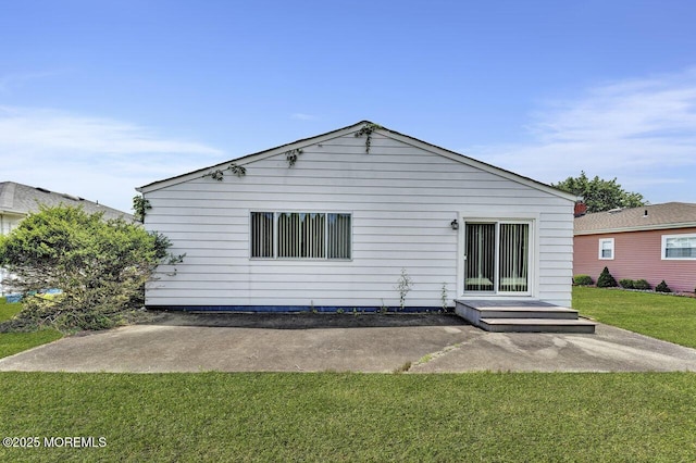 119 Hyannis St, Toms River, NJ 08757 - rear view of house featuring a lawn and a patio