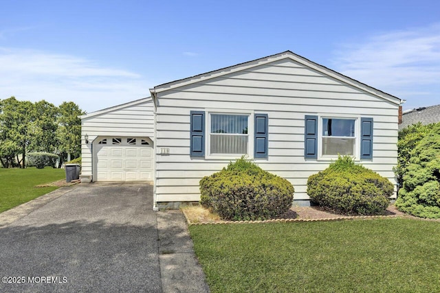 119 Hyannis St, Toms River, NJ 08757 - view of front of house featuring an attached garage, asphalt driveway, and a front yard