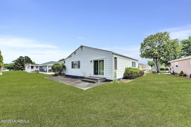 119 Hyannis St, Toms River, NJ 08757 - rear view of property featuring a yard and a patio area
